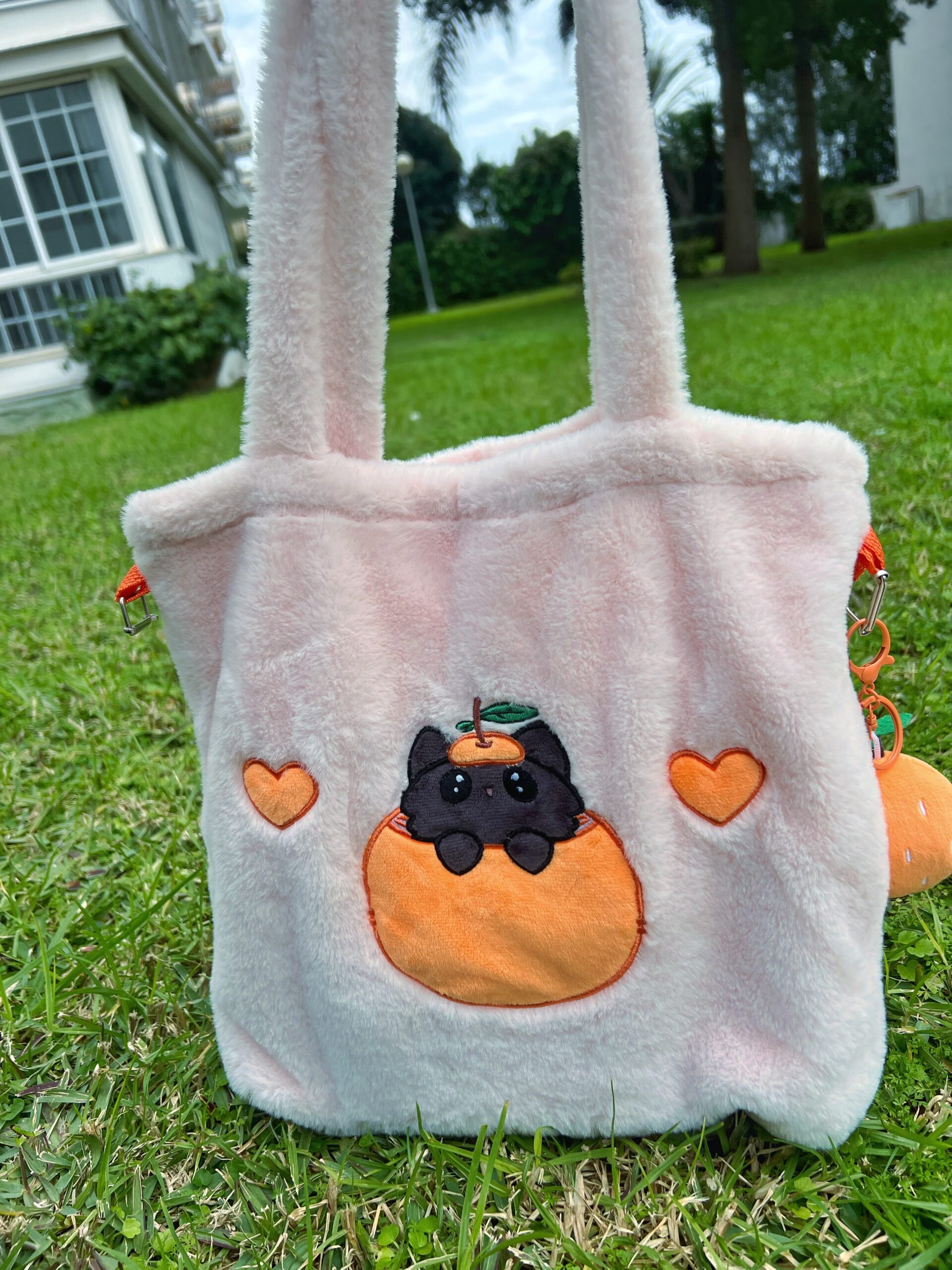 Bolso bandolera de peluche rosa con forma de gato mandarino Peluso