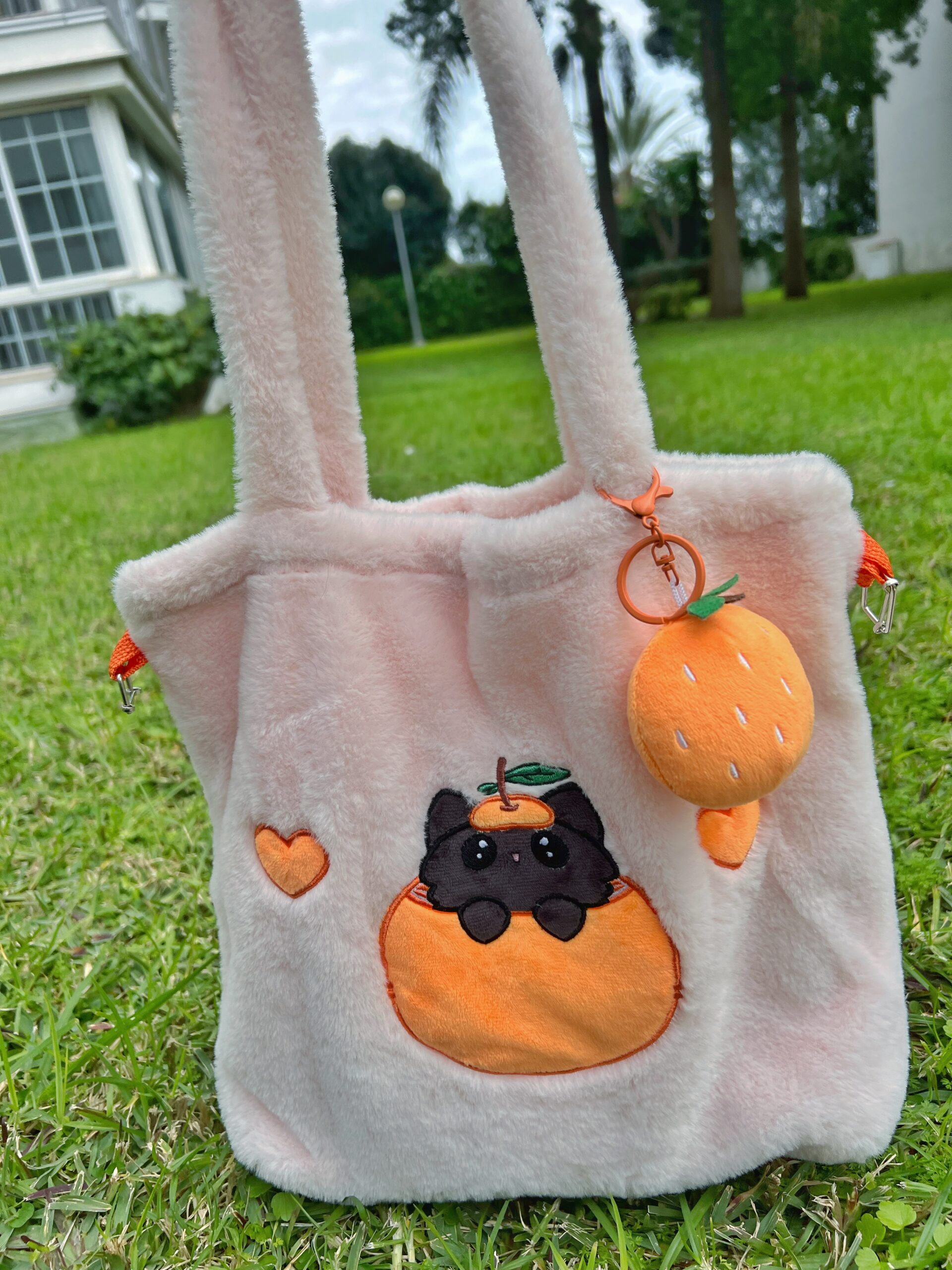 Bolso bandolera de peluche rosa con forma de gato mandarino Peluso