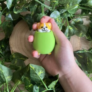 Llavero tipo clicker con impresión 3D del gato aceituno (Benjamín) que es un gato naranja y blanco metido en una aceituna verde